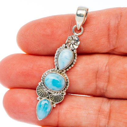 Sterling silver larimar pendant with three oval light blue stones and scalloped bezel