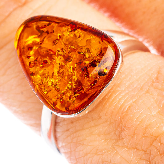 Amber teardrop ring with .925 sterling silver band and faceted amber cabochon