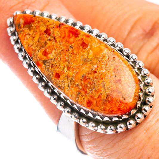 Sterling silver ring with teardrop orange sponge coral cabochon and beaded bezel