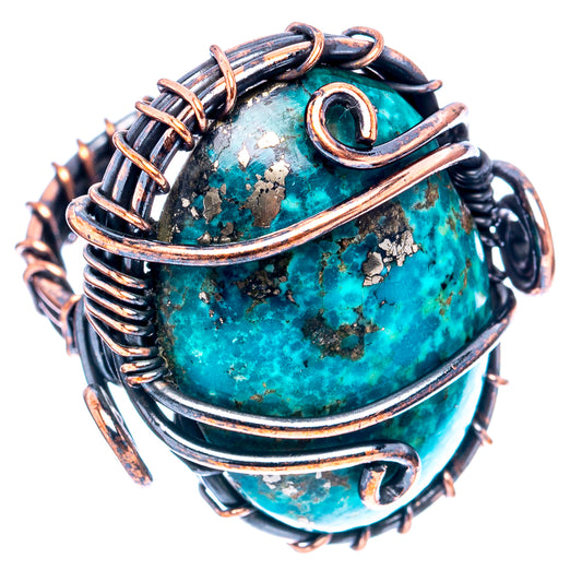 Turquoise oval cabochon wire-wrap ring with dark copper frame and side loops