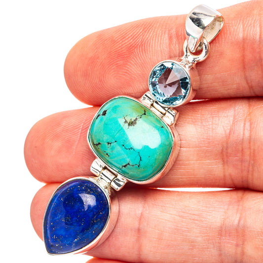 Oval turquoise and lapis lazuli sterling silver pendant with round blue stone and bail