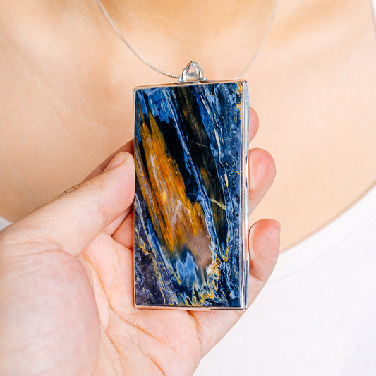 Rectangular Pietersite pendant, .925 sterling silver frame with blue and gold veining