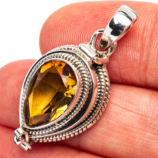 Oval citrine pendant in .925 sterling silver with ornate oval bezel and bail