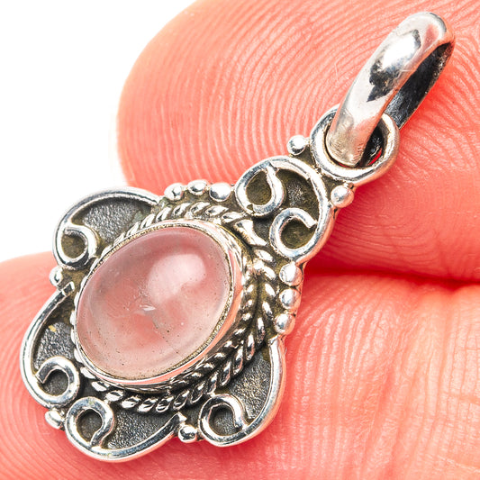 Rose quartz pendant, .925 sterling silver, oval pink stone in ornate halo with bail