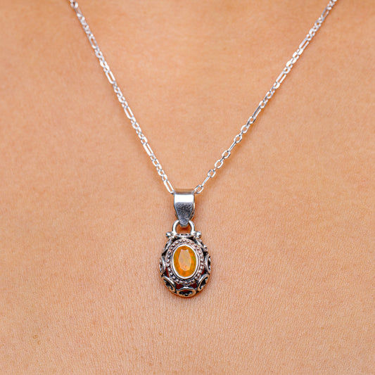 Sterling silver fire opal pendant necklace with oval orange opal center and ornate frame