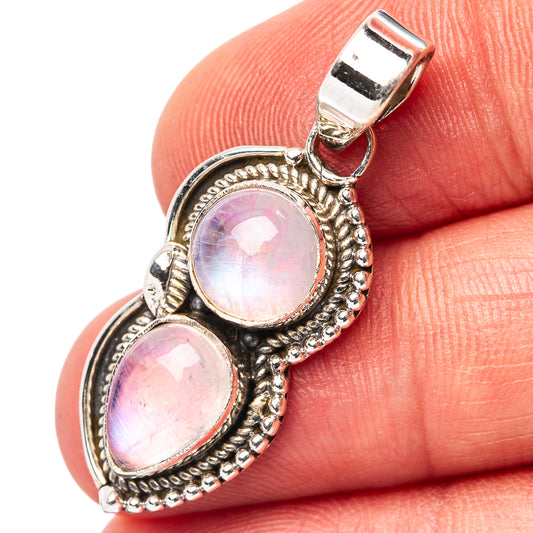 Sterling silver moonstone pendant with two oval pink stones and ornate bezel detail