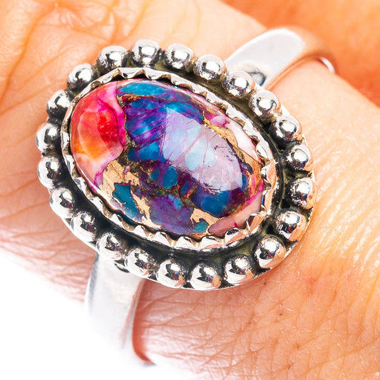 Sterling silver ring with oval multicolor stone and beaded halo band