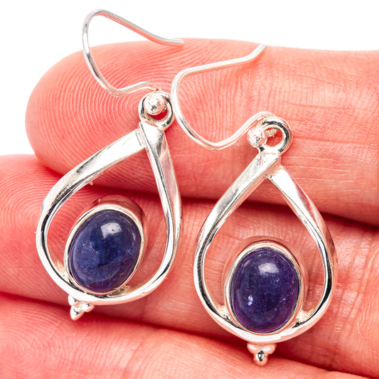 Sterling silver teardrop earrings with deep purple-blue round gemstone detail