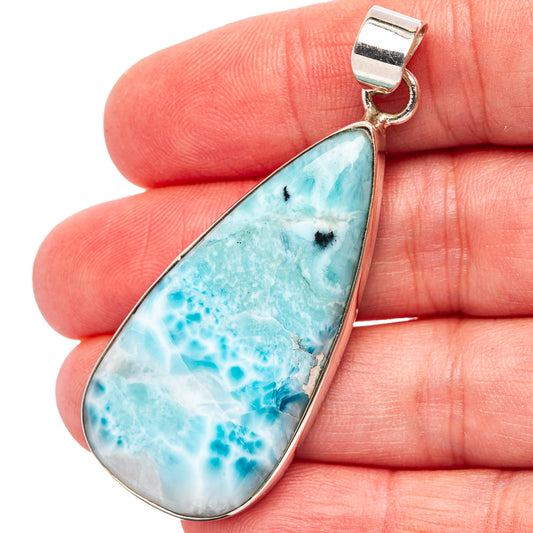 Sterling silver larimar teardrop pendant, bail loop with stone face.