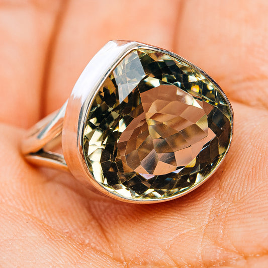 Sterling silver ring with oval faceted green amethyst, side angle on finger