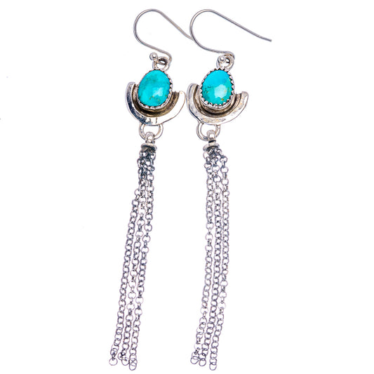 Turquoise drop earrings with oval settings and long silver chain tassels