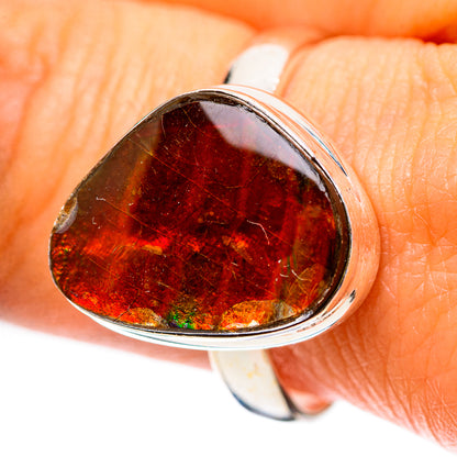 Sterling silver ammolite ring with oval amber-red stone, silver bezel setting