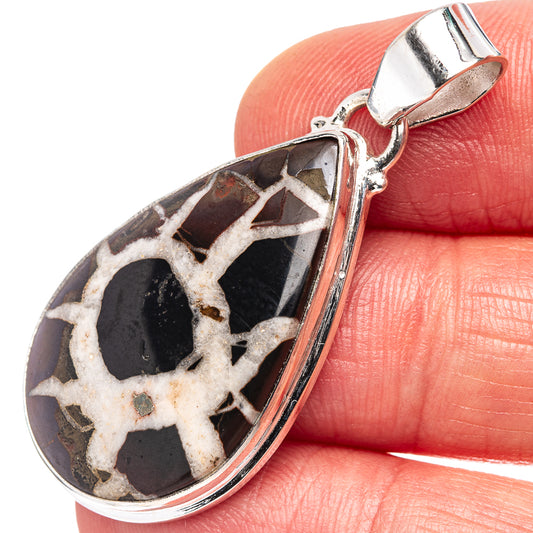 Sterling silver septarian pendant with teardrop cabochon and ornate bail
