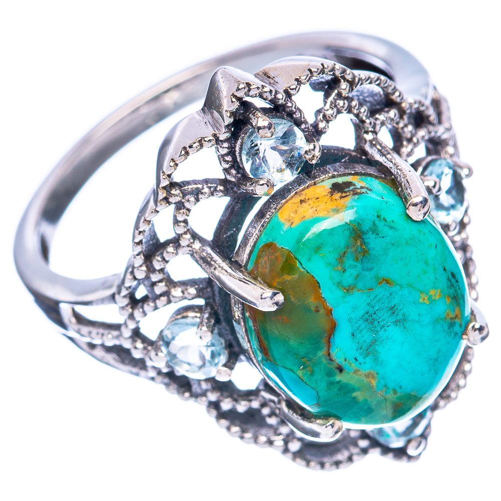 Turquoise oval cabochon sterling silver ring with cluster bezel and prong-set clear stones
