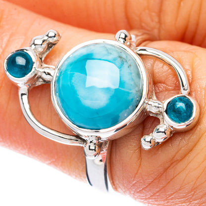 Sterling silver ring with large oval blue-green stone and round teal side stones