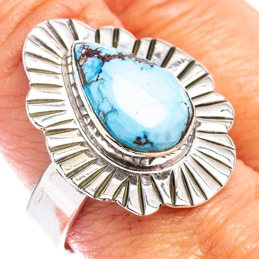 Sterling silver adjustable ring with oval turquoise stone and raised sunburst border