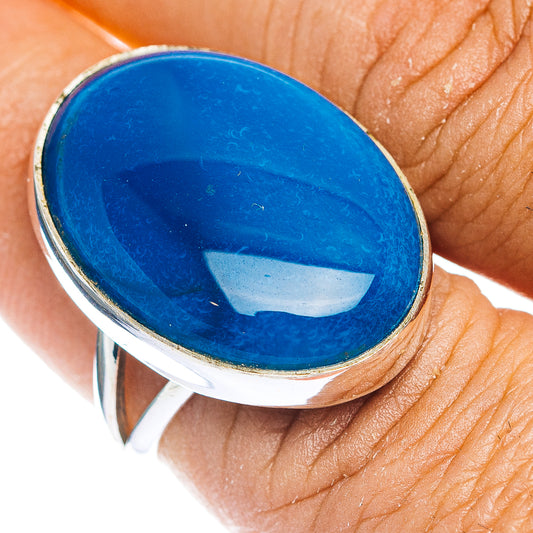 Oval blue opal ring with silver bezel setting, narrow sterling band