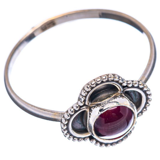 Sterling silver ring band with maroon garnet oval and beaded heart bezel