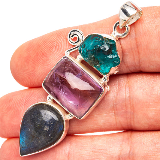 Three-stone .925 silver pendant: purple amethyst, teal-blue gem, dark labradorite.