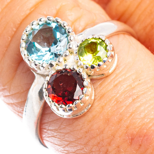 Sterling silver gemstone ring with blue topaz, green peridot and red garnet stones