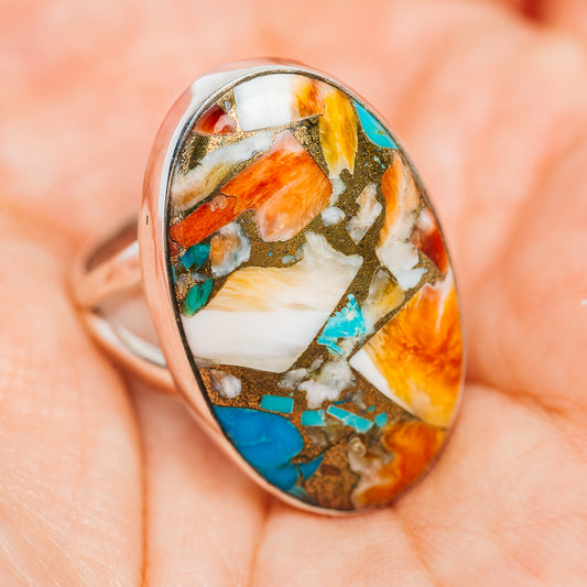 Oval .925 sterling silver ring with turquoise, orange, and white inlay, size 7