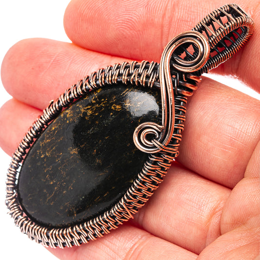 Oxidized copper wire-wrapped teardrop pendant with dark pietersite stone