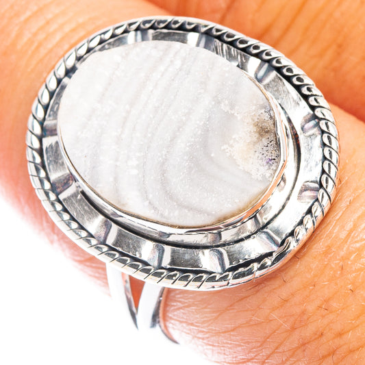 Silver oval druzy stone ring with ornate rope bezel band