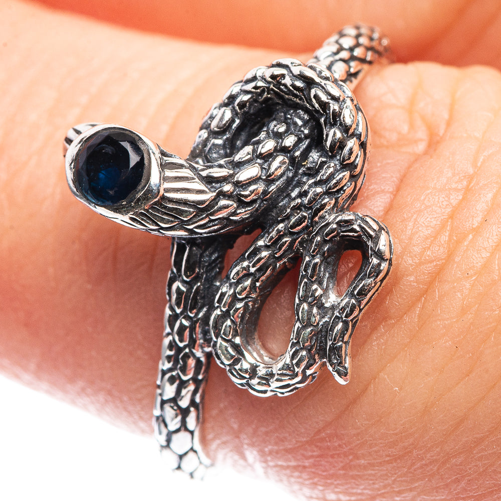 Sterling silver snake ring with textured coil and dark blue oval gemstone