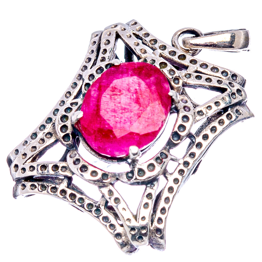 Oval red gemstone pendant with ornate sterling silver filigree and top loop bail
