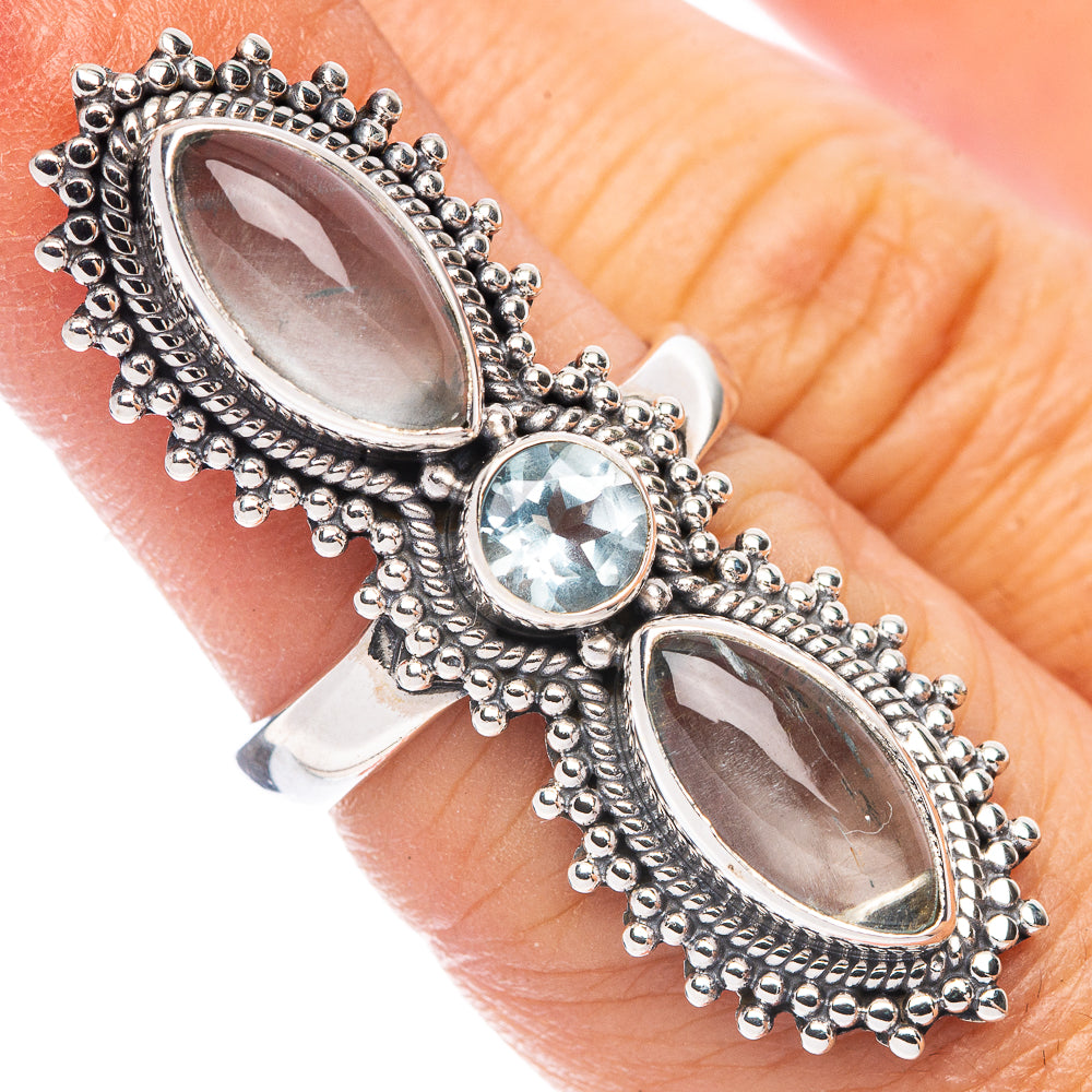 Sterling silver ring with round blue gemstone and two oval marquise stones