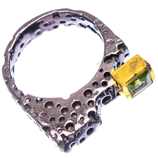 Dark-finished sterling silver ring with square green peridot-style stone, close-up