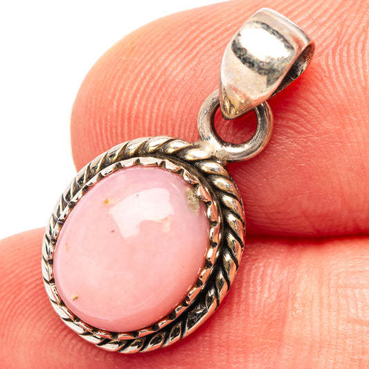 Pink opal pendant charm in .925 sterling silver with oval pink cabochon and rope bezel