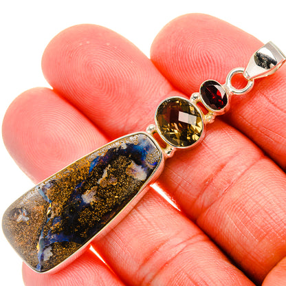 Sterling silver pendant with blue-gold boulder opal and yellow round gemstone accents