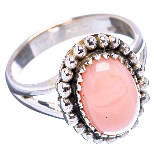 Sterling silver ring with oval pink bezel and raised beadwork, side view