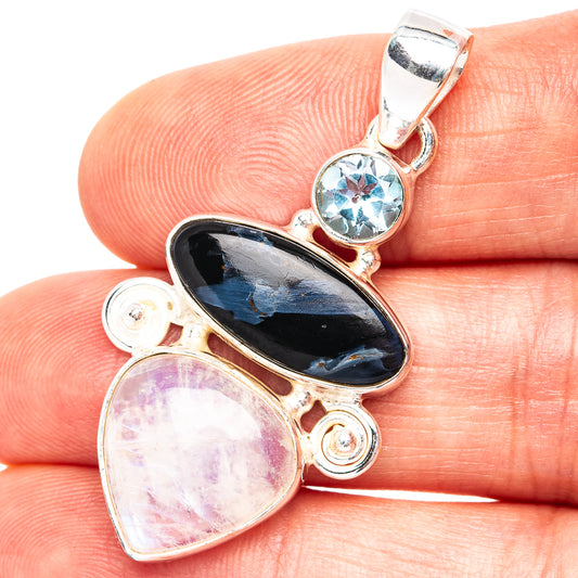 Sterling silver pendant with round blue gemstone and oval dark and light pink stones