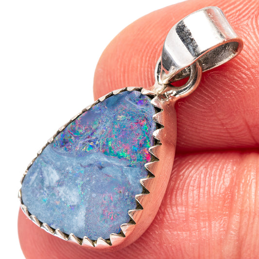 Sterling silver teardrop opal pendant with prong-set blue and iridescent speckled stone