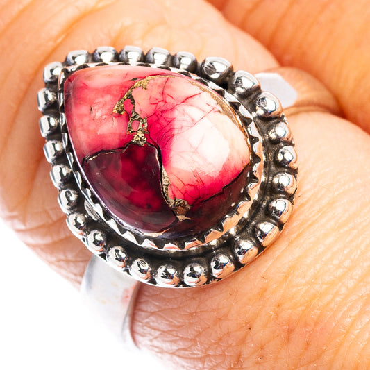 Sterling silver ring with bezel-set red teardrop gemstone and beaded halo