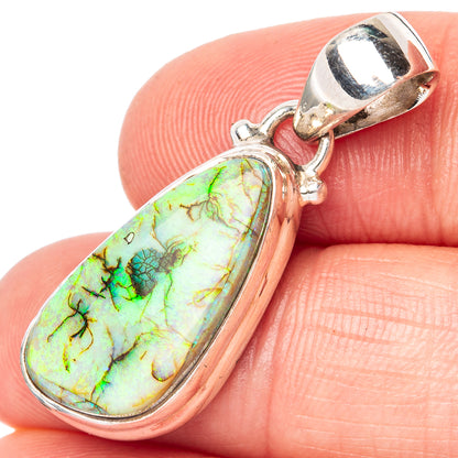 Sterling silver oval opal pendant, green/yellow stone in bezel, close-up view