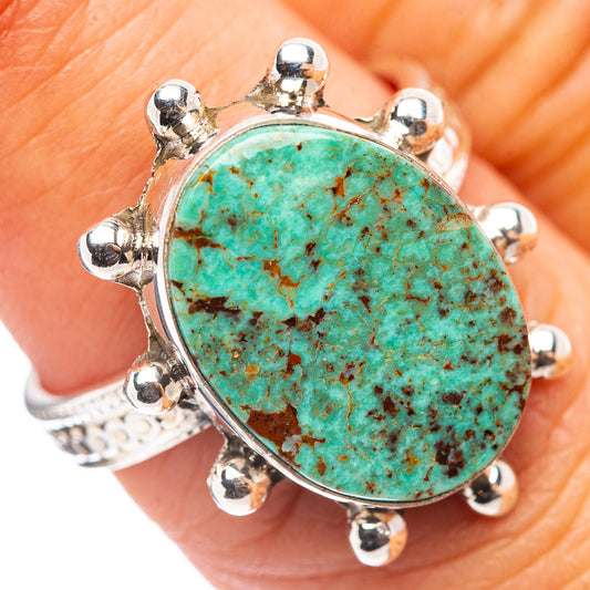 Sterling silver ring with large oval turquoise cabochon and eight bead prongs