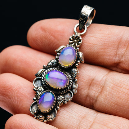 Ornate .925 sterling silver three-opal pendant with iridescent oval stones and bail
