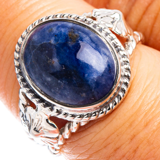 Oval blue sodalite cabochon sterling silver ring with ornate leaf-like bezel
