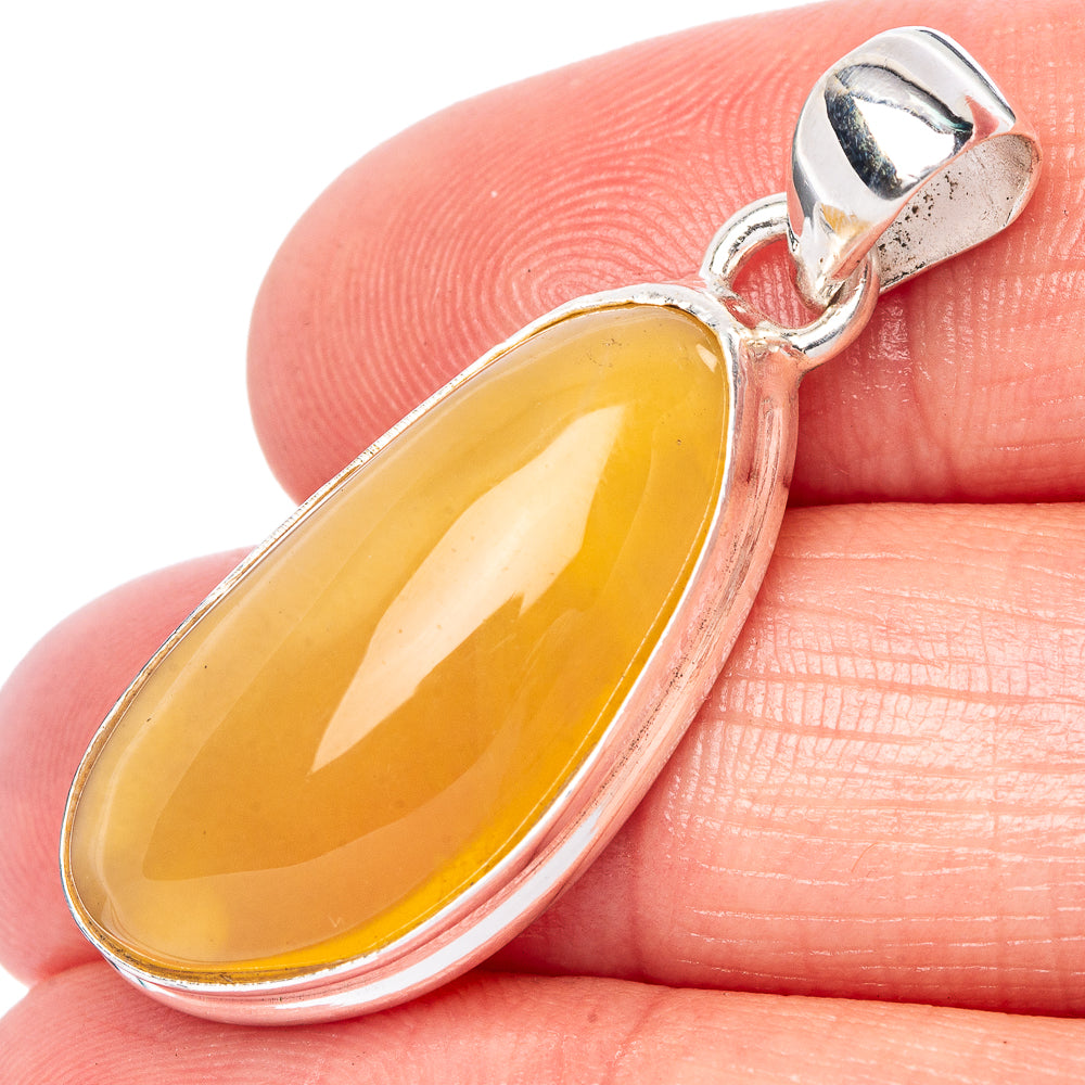 Oval amber gemstone pendant in 925 sterling silver with hinged bail