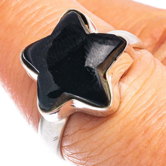 Black onyx star ring on finger, .925 sterling silver star-shaped bezel