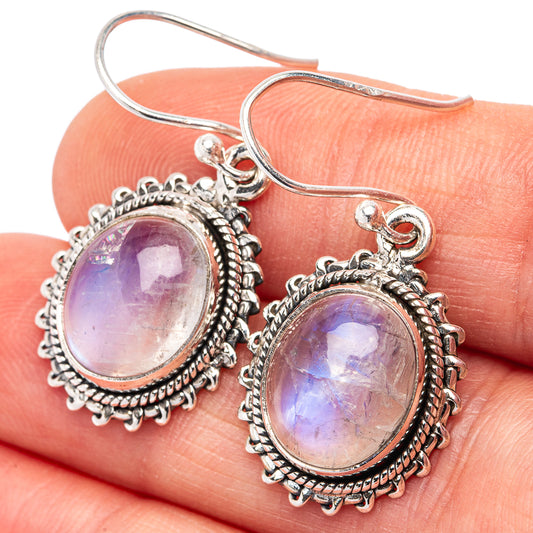 Oval moonstone drop earrings in .925 sterling silver, purple iridescent center, ornate frame