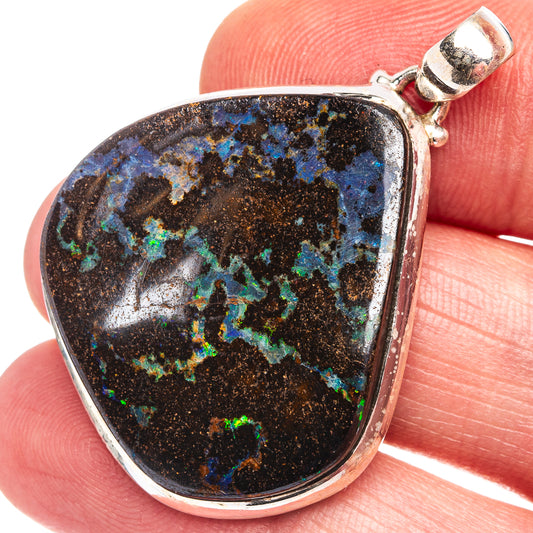 Sterling silver boulder opal pendant with teardrop stone, blue and green flashes on dark matrix