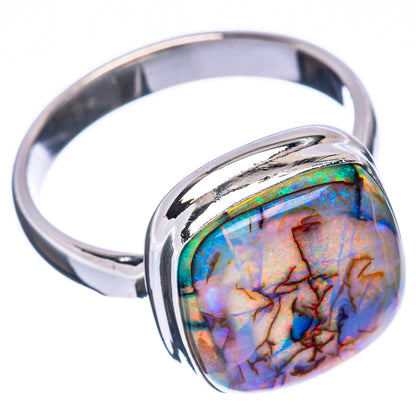 Sterling silver opal ring with oval opal stone in raised bezel, shiny band