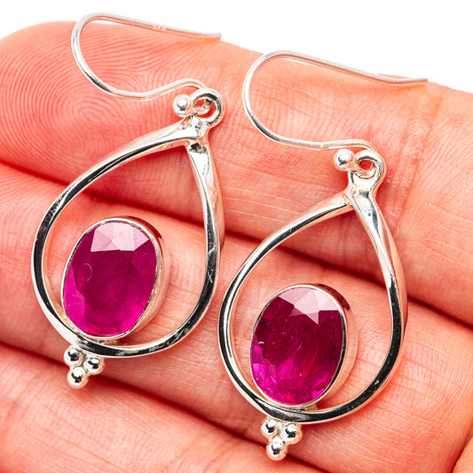 Sterling silver teardrop earrings with purple ruby-color glass centers