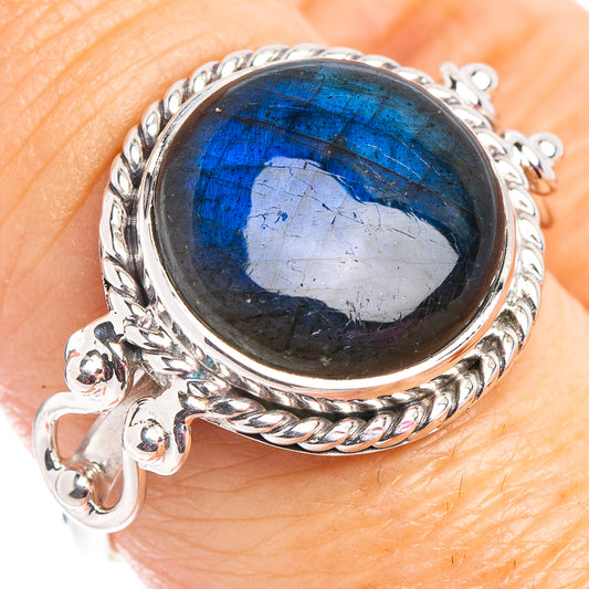 Sterling silver labradorite ring with oval blue cabochon and braided bezel halo