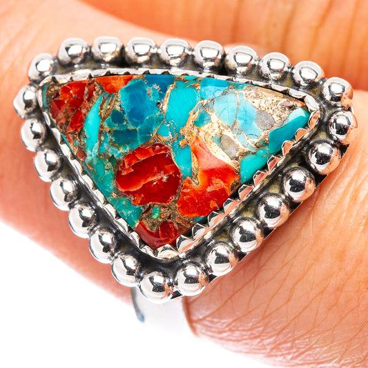 Sterling silver coral matrix ring on finger, bezel set with turquoise and red mosaic