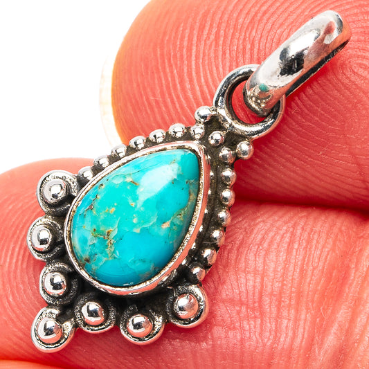 Turquoise teardrop pendant in .925 sterling silver with ornate bead border and loop bail